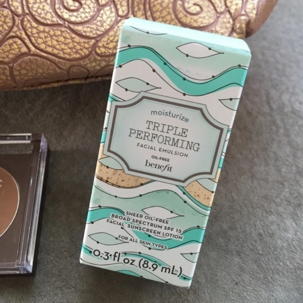 Makeup bag, sunscreen and Cover Girl bronzer